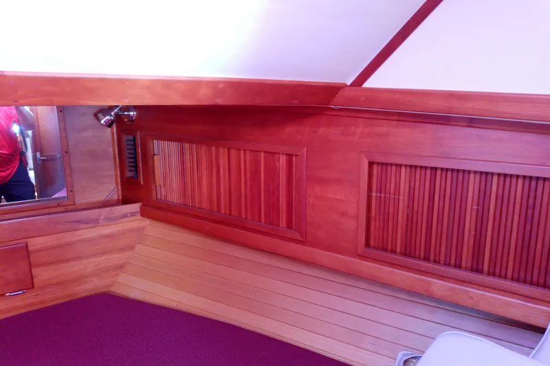 Slide: The Image of Interior of 2002 Sabreline 36 Express with wooden paneling and red carpet. - 69