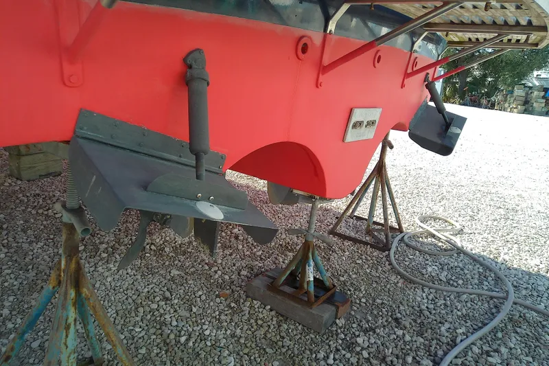 Slide: The Image of 2002 Sabreline 36 Express boat hull on stands, showing propeller and rudder. - 9