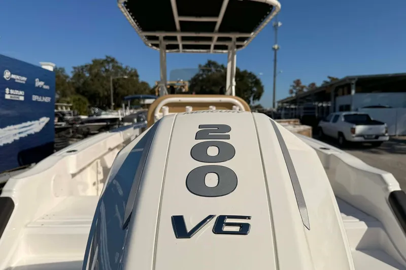 Slide: The Image of 2026 Bayliner Trophy T22CC boat with rod holders and cup holders on deck. - 11