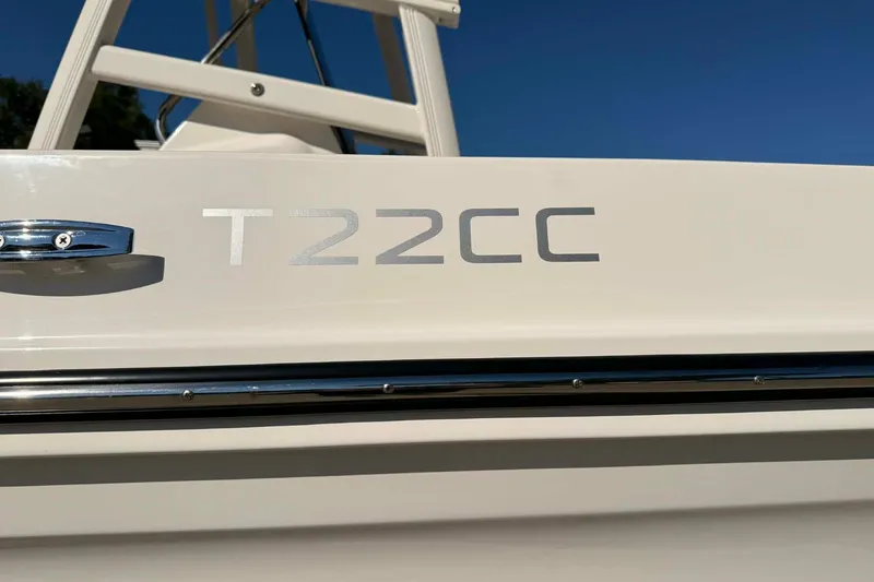 Slide: The Image of 2026 Bayliner Trophy T22CC helm with steering wheel and Simrad display. - 3