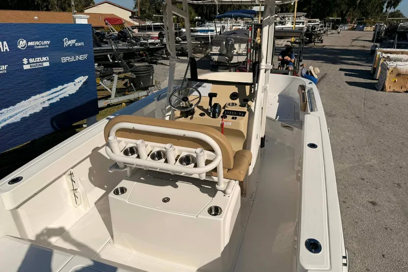 Slide: The Image of 2026 Bayliner Trophy T22CC boat seat with tan cushions and storage compartment. - 5