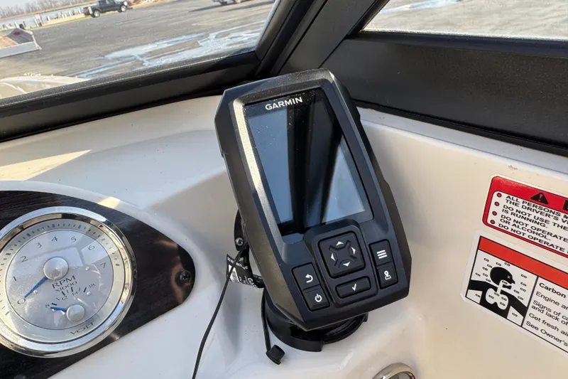 Slide: The Image of 2022 Stingray 191 DC dashboard featuring Garmin GPS and RPM gauge. - 14