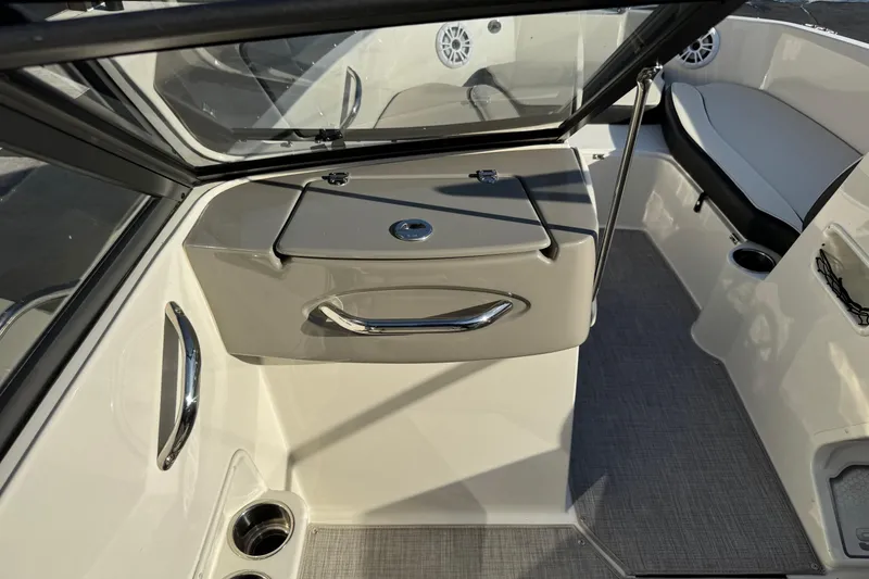 Slide: The Image of 2022 Stingray 191 DC boat interior with seating and storage compartments. - 15