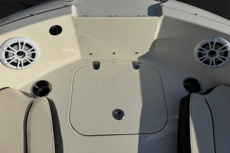 Slide: The Image of 2022 Stingray 191 DC boat interior with speakers and seating area. - 26