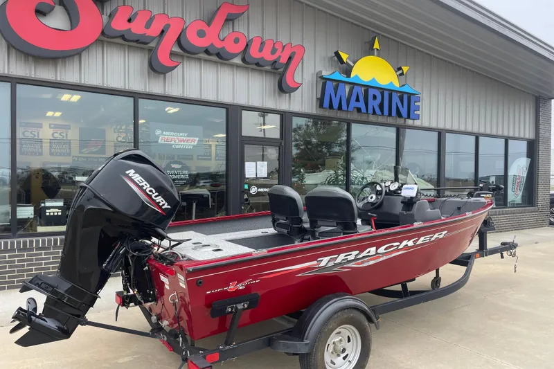 Slide: The Image of 2021 Tracker Pro Guide V-16 SC boat outside Sundown Marine dealership. - 2