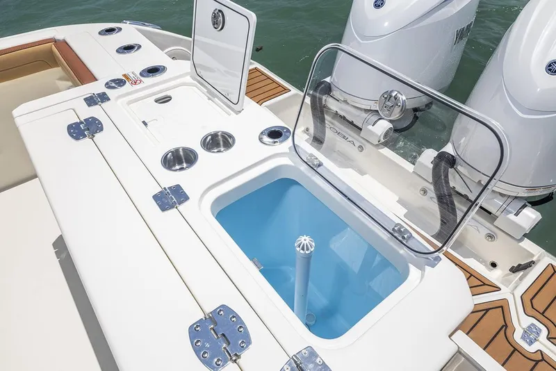 Slide: The Image of Manufacturer Provided Image: 2025 Cobia 265 Center Console Open boat with open storage compartments and dual engines. - 18