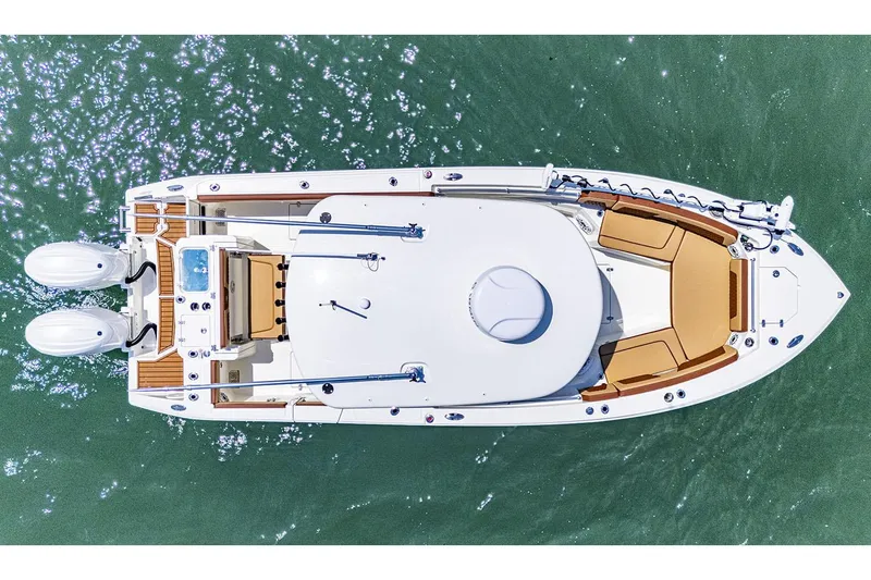 Slide: The Image of Manufacturer Provided Image: Aerial view of 2025 Cobia 265 Center Console Open boat on water. - 9