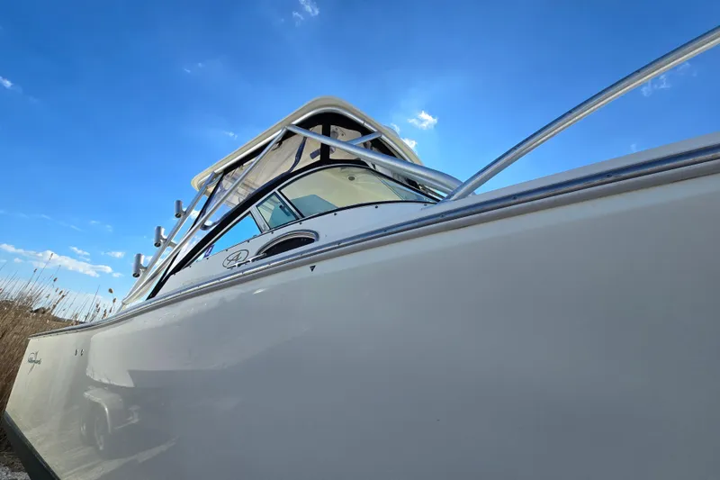 Slide: The Image of 2006 Albemarle 268 Express Fisherman boat under clear blue sky. - 16