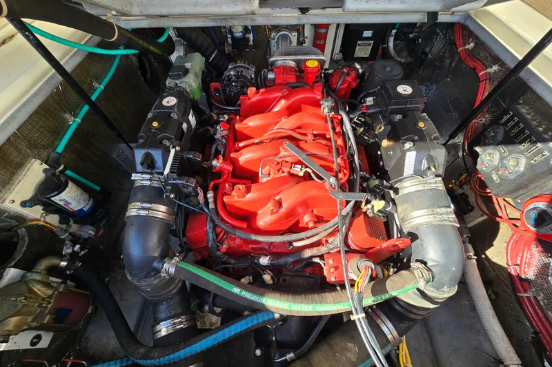 Slide: The Image of Engine compartment of a 2006 Albemarle 268 Express Fisherman boat, featuring a red engine. - 19