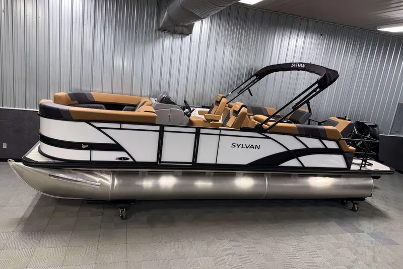 The Image of 2026 Sylvan L3 LZ pontoon boat in showroom, featuring sleek design and tan seating. - 0