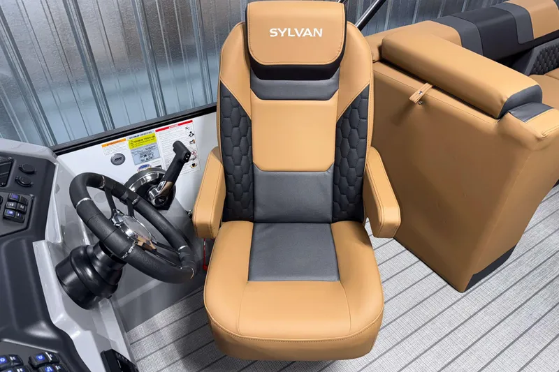 Slide: The Image of Captain's chair in 2026 Sylvan L3 LZ boat, featuring tan and black upholstery. - 10