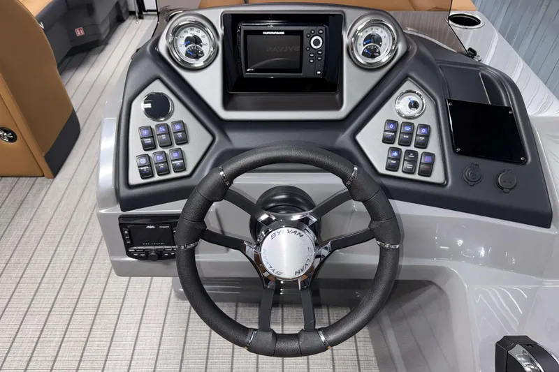 Slide: The Image of 2026 Sylvan L3 LZ boat dashboard with steering wheel and control panel. - 11