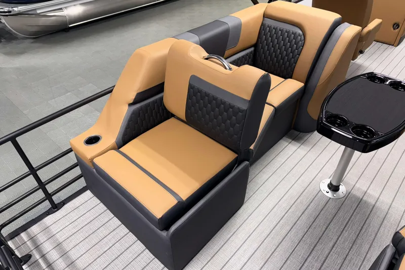 Slide: The Image of Luxurious seating on 2026 Sylvan L3 LZ pontoon boat with cup holders and table. - 17