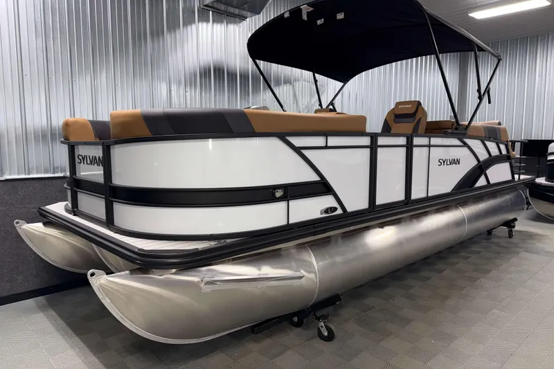 Slide: The Image of 2026 Sylvan L3 LZ pontoon boat with canopy in showroom. - 23