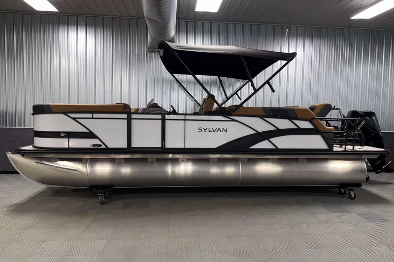 Slide: The Image of 2026 Sylvan L3 LZ pontoon boat with canopy in a showroom setting. - 26