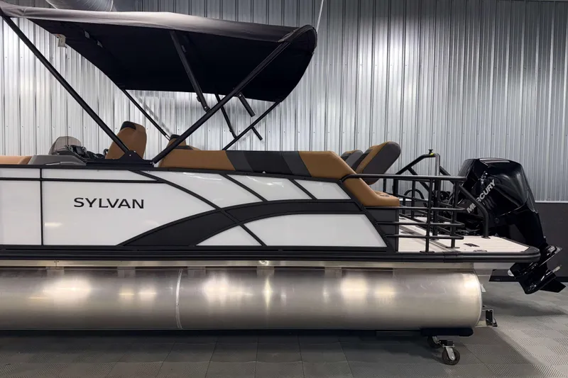 Slide: The Image of 2026 Sylvan L3 LZ pontoon boat with Mercury outboard motor in showroom. - 28