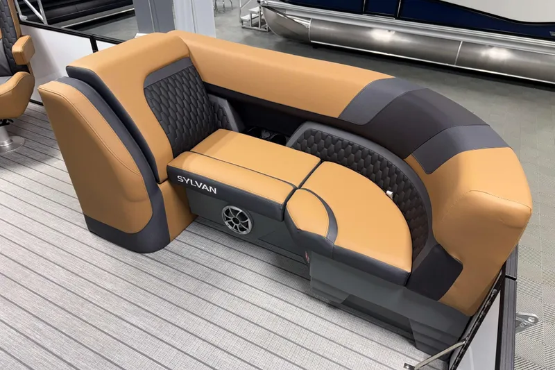 Slide: The Image of 2026 Sylvan L3 LZ boat seating with tan and gray upholstery, featuring a built-in speaker. - 3