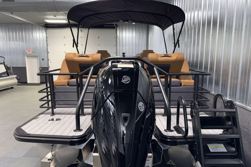 Slide: The Image of 2026 Sylvan L3 LZ pontoon boat with sleek design and powerful outboard motor. - 31