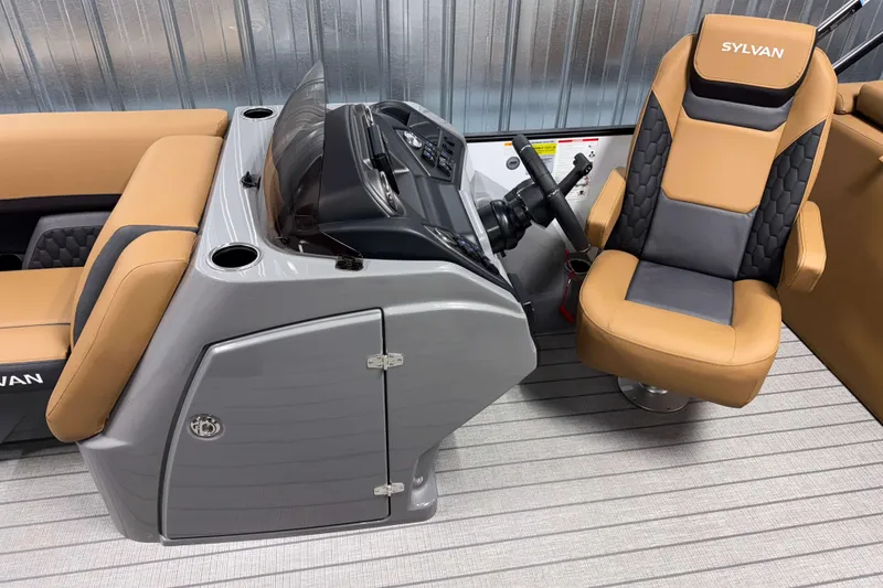 Slide: The Image of 2026 Sylvan L3 LZ boat interior with tan and gray seating, modern helm design. - 8
