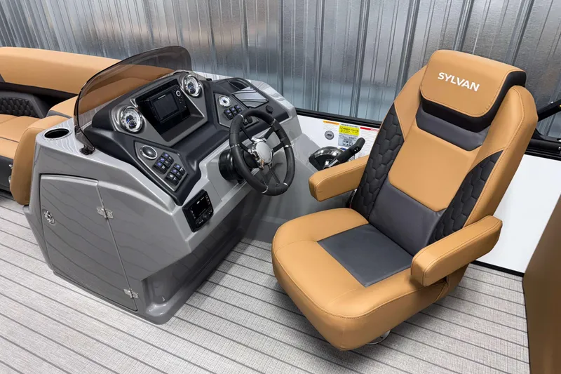 Slide: The Image of 2026 Sylvan L3 LZ boat interior with modern helm and luxurious captain's chair. - 9
