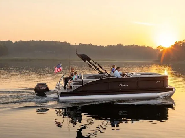 The Image of 2024 Barletta Aria A22CC boat cruising on a lake at sunset. - 0