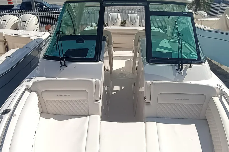 Slide: The Image of 2026 Grady-White Freedom 325 boat interior with luxurious seating and windshield. - 25