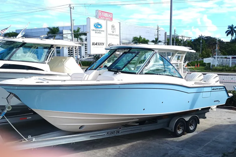 Slide: The Image of Grady-White Freedom 325 boat, 2026 model, on a trailer. - 32