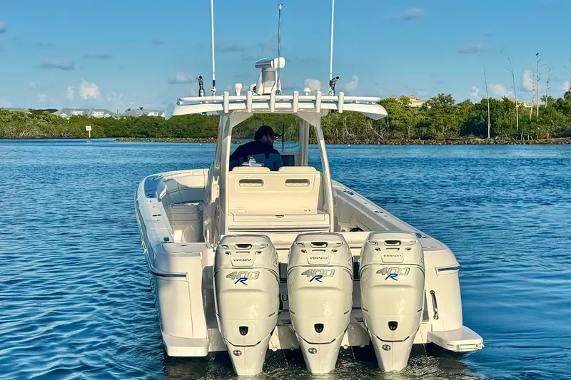 Slide: The Image of 2020 Intrepid 375 Nomad SE boat with triple 400R engines on calm water. - 9
