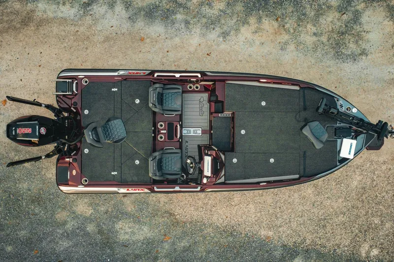 Slide: The Image of 2026 Bass Cat Lynx STS fishing boat, top view, showcasing spacious deck and seating arrangement. - 2