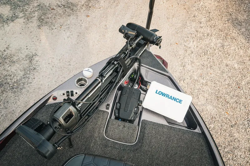 Slide: The Image of 2026 Bass Cat Lynx STS boat deck with Lowrance equipment and trolling motor. - 25
