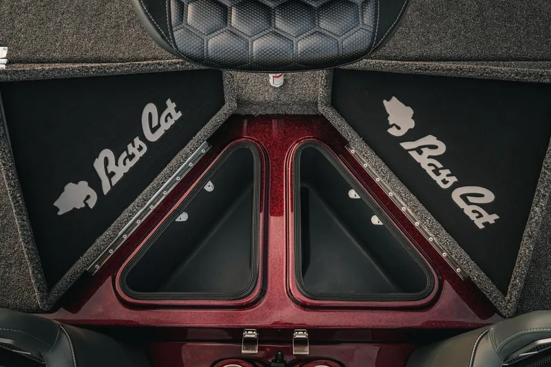 Slide: The Image of 2026 Bass Cat Lynx STS boat interior with storage compartments and logo. - 29