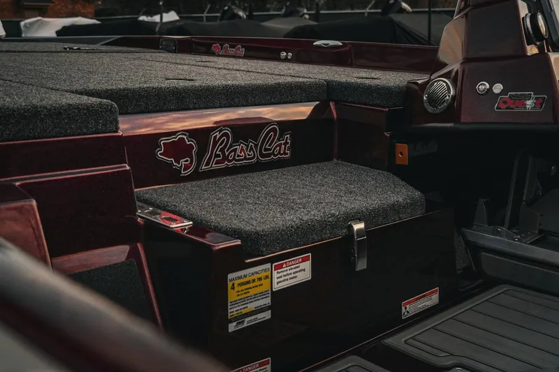 Slide: The Image of 2026 Bass Cat Lynx STS boat interior with logo and seating details. - 34