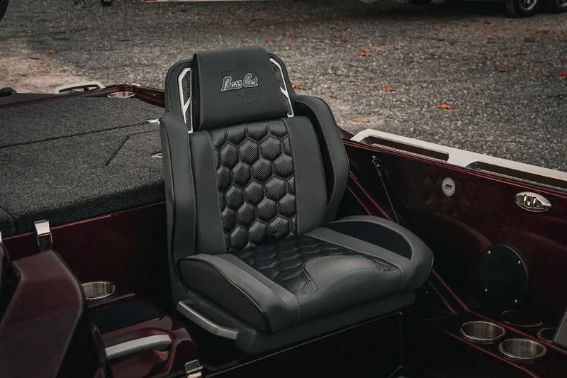 Slide: The Image of 2026 Bass Cat Lynx STS boat seat with hexagonal pattern and logo detailing. - 38