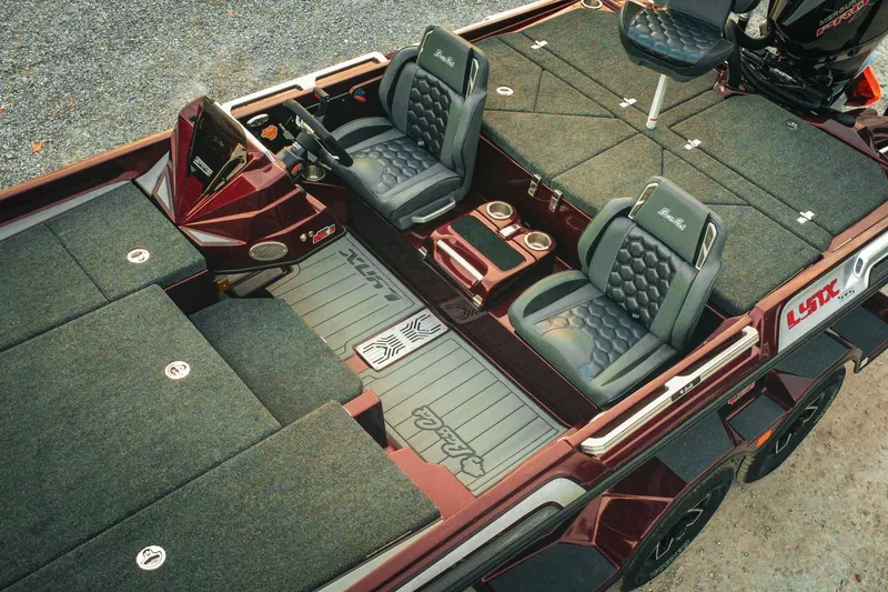 Slide: The Image of 2026 Bass Cat Lynx STS boat interior with plush seating and ample storage. - 4