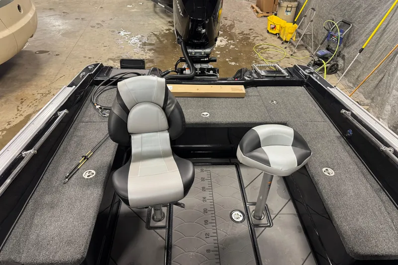 Slide: The Image of 2026 Nitro ZV21 Pro boat interior with two seats and fishing rod holder. - 10