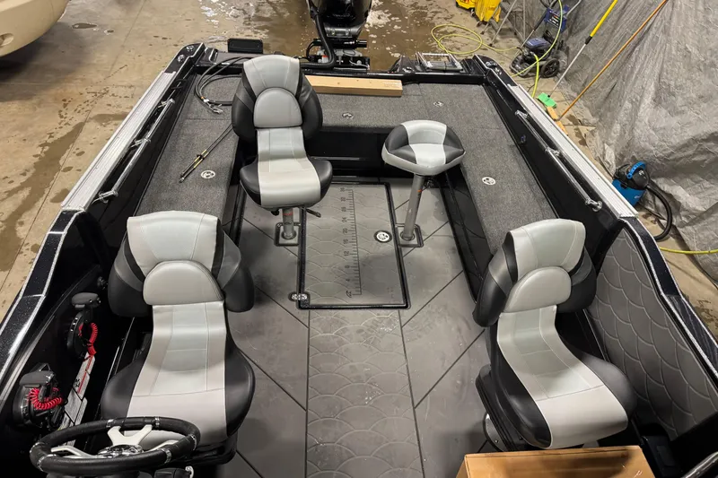 Slide: The Image of Interior of 2026 Nitro ZV21 Pro boat with modern seating and steering wheel. - 13