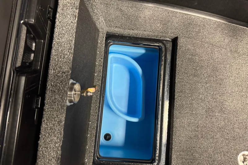 Slide: The Image of Storage compartment in 2026 Nitro ZV21 Pro boat with blue interior. - 18