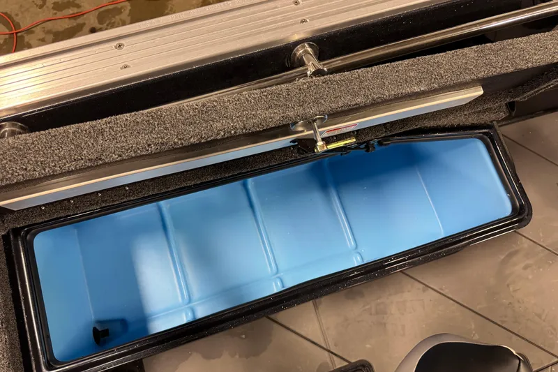 Slide: The Image of Open storage compartment of 2026 Nitro ZV21 Pro, featuring a blue interior. - 19