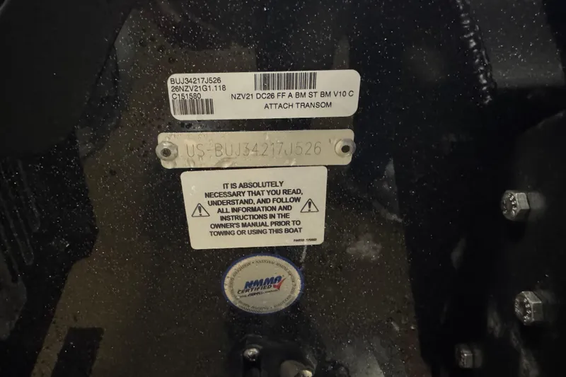 Slide: The Image of Close-up of Nitro ZV21 Pro 2026 boat transom with identification labels and safety instructions. - 5