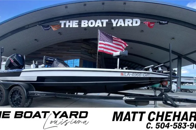 The Image of 2023 Blazer 625 Pro Elite boat at The Boat Yard, Louisiana, with American flag. - 1
