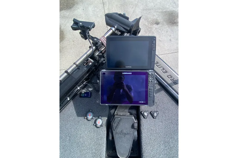 Slide: The Image of 2023 Blazer 625 Pro Elite boat dashboard with Garmin and Lowrance displays. - 12