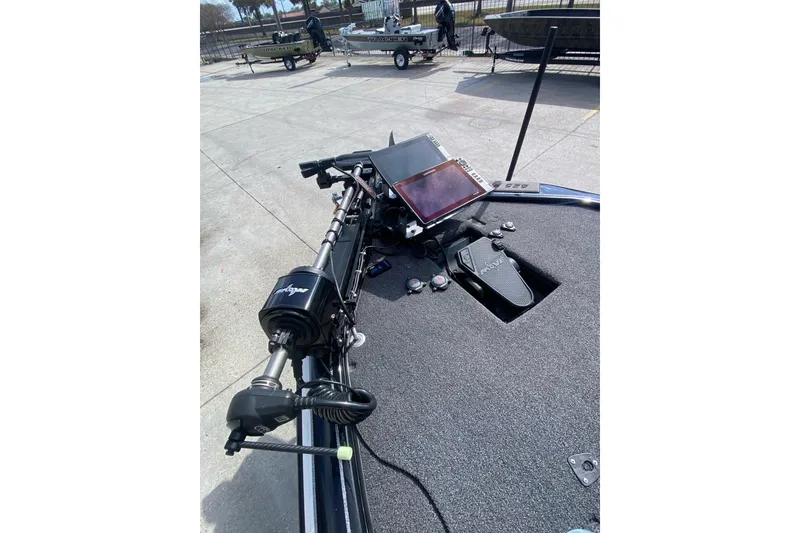 Slide: The Image of 2023 Blazer 625 Pro Elite boat with advanced navigation system and controls. - 13