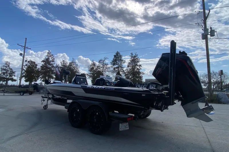 Slide: The Image of 2023 Blazer 625 Pro Elite boat on trailer under a partly cloudy sky. - 5