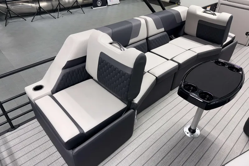 Slide: The Image of Luxurious seating on 2026 Sylvan L3 SLZ pontoon boat with modern design and cup holders. - 17