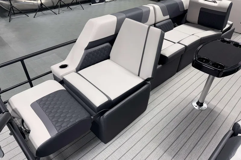 Slide: The Image of Luxurious seating on 2026 Sylvan L3 SLZ pontoon boat with modern design and cup holders. - 18