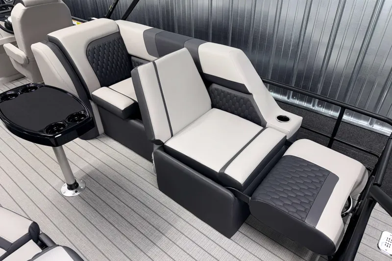 Slide: The Image of 2026 Sylvan L3 SLZ boat interior with modern seating and cup holders. - 21