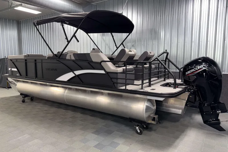 Slide: The Image of 2026 Sylvan L3 SLZ pontoon boat with Mercury outboard motor in a showroom. - 30