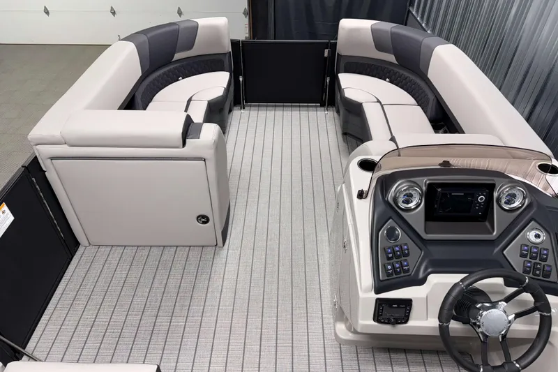 Slide: The Image of 2026 Sylvan L3 SLZ pontoon boat interior with modern seating and control panel. - 6