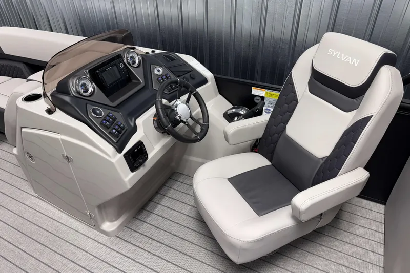 Slide: The Image of 2026 Sylvan L3 SLZ boat interior with modern dashboard and comfortable captain's chair. - 9