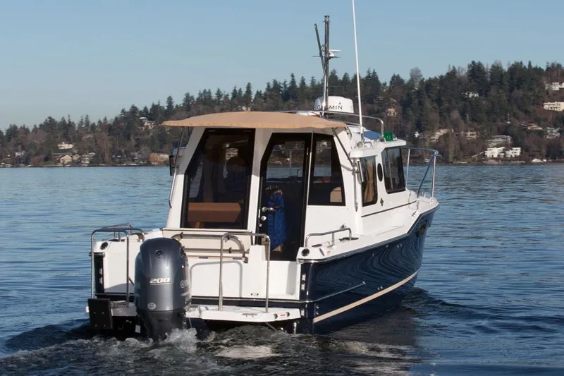 Slide: The Image of Manufacturer Provided Image: 2025 Ranger Tugs R-23 boat cruising on a calm lake. - 6